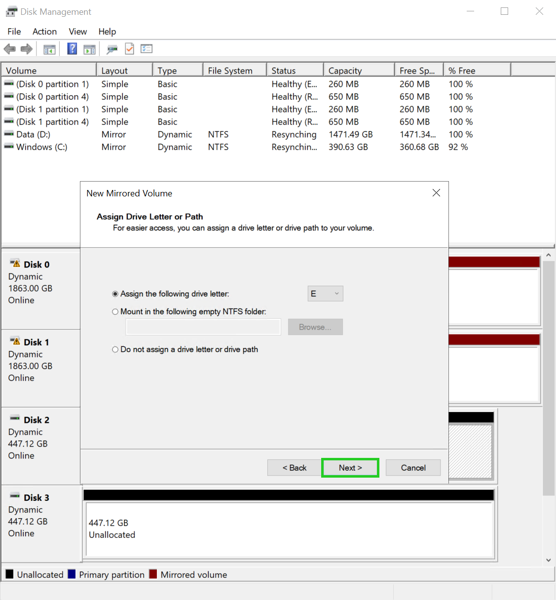 The New Mirrored Volume wizard with the Next button highlighted.